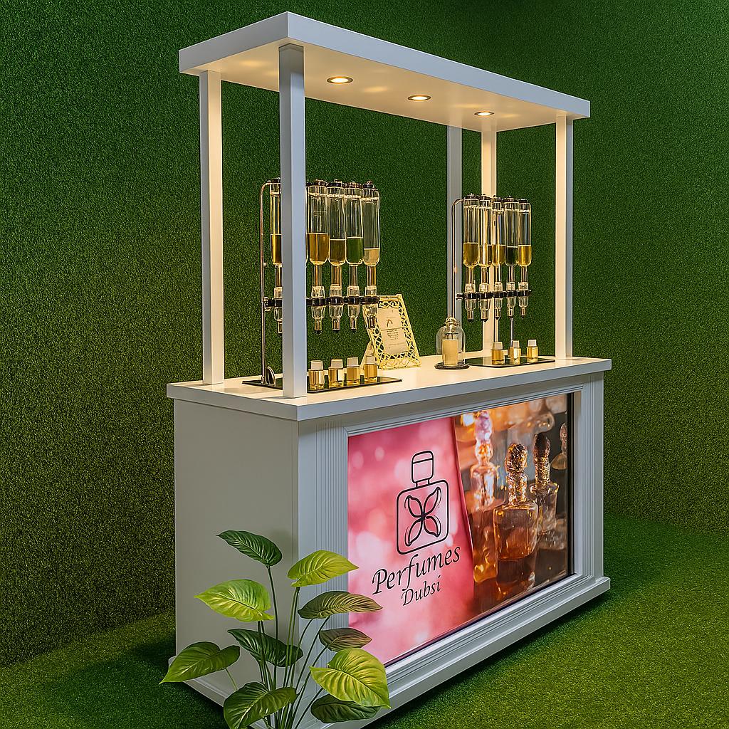 Perfume Booth setup in Dubai featuring a branded fragrance bar with colorful dispensers, interactive screen, and artificial grass backdrop for events and exhibitions
